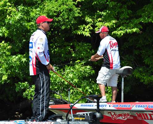 <p>
	Russ Lane (left) and Scott Rook pass one another along the shore Saturday, briefly exchanging pleasantries.</p>
