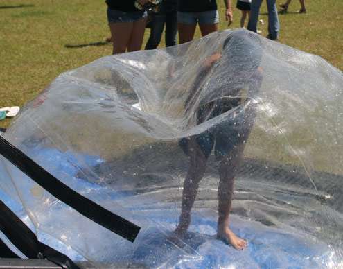 <p>
	A kid gets out of a bubble he was in.</p>
