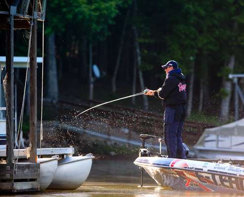 <p>
	David Walker slings a cast alongside a boat dock.</p>
