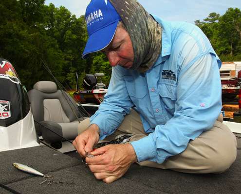 <p> 	Mark Menendez does some last minute tackle preparation in his boat on Wednesday.</p> 