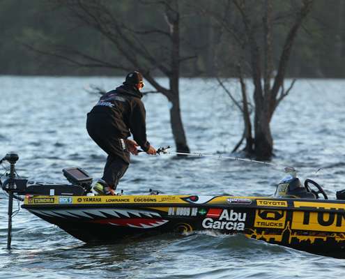 <p>
	Mike Iaconelli reaches for another rod as fish begin to break on a point.</p>
