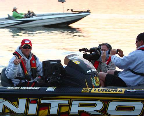 <p>
	Kevin VanDam salutes one of the three cameras pointed at him Sunday morning.</p>
