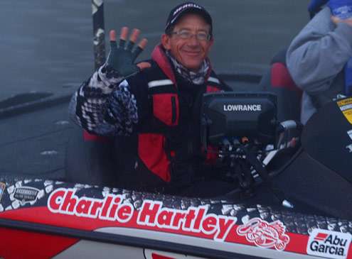 <p>
	Charlie Hartley waves to fans on the dock as he idles out onto West Point Lake.</p>
