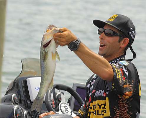 <p>
	Mike Iaconelli holds up his largest fish that was part of his comeback bag on Friday.</p>
