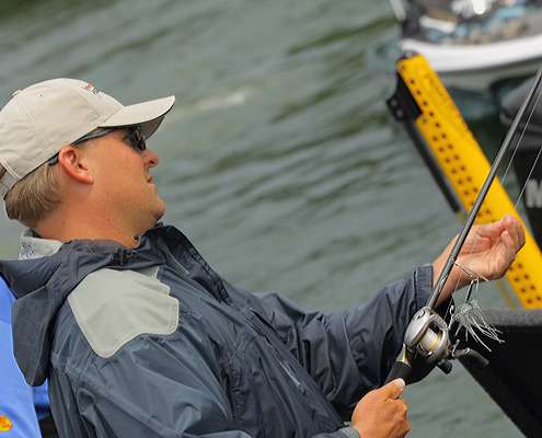 <p>
	Dustin Wilks wraps up his rods after Day Three on Lake Murray.</p>
