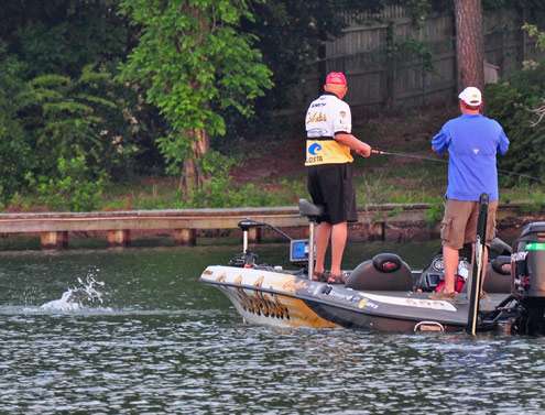 <p>
	Dave Smith sets the hook and a bass comes crashing to the surface on Day Two.</p>
