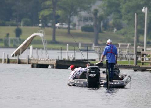 <p>
	Murray gets down in the passenger seat to land the 4-pound bass.</p>
