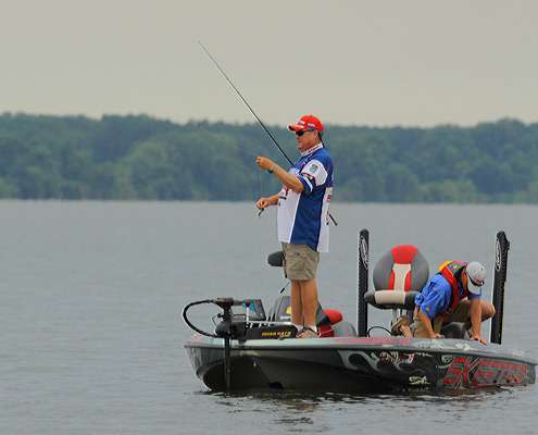 <p>
	After bagging his first catch of the day, Mark Davis checks his line.</p>
