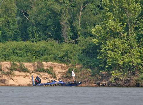 <p> 	In the distance, Chad Griffin fishes along the bank on the Arkansas River in preparation for the Diamond Drive.</p> 