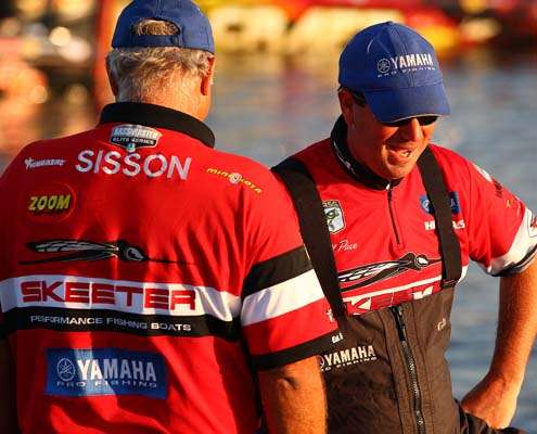 <p>
	Lee Sisson and Cliff Pace joke around while waiting for the start of Day One.</p>
