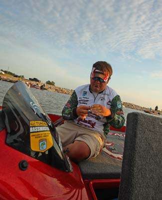 <p>
	 </p>
<p>
	Greg Hackney ties on a lure before the start of the final day.</p>
