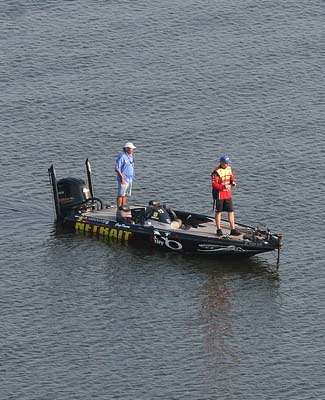 <p>
	A mile away in the Pine Bluff Harbor, Greg Vinson fishes a drop-off.</p>
