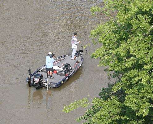 <p>
	Aaron Martens fishes within sight of the take off Sunday in Little Rock.</p>
