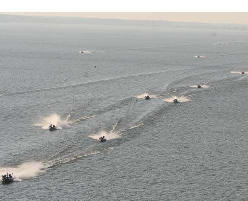 <p>
	 </p>
<p>
	A line of spectator boats follow the competitors across Lake Wheeler.</p>
