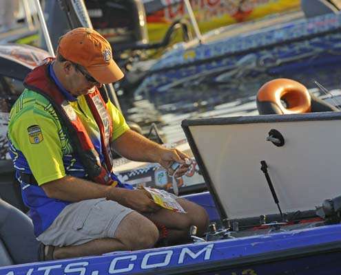 <p>
	Steve Kennedy goes over his tackle options on Day One. Kennedy is in position to win the Toyota Tundra Bassmaster Angler of the Year title.</p>
