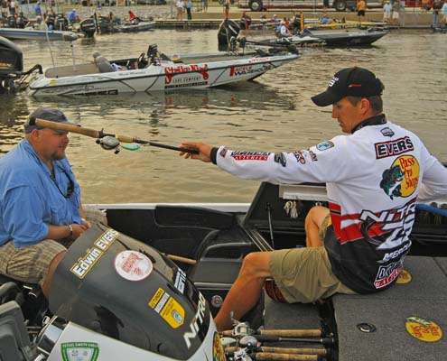 <p>
	Edwin Evers, one of the only anglers left who has a long shot at over taking Kevin VanDam for the Toyota Tundra Bassmaster Angler of the Year title, prepares his rods for the day.</p>
