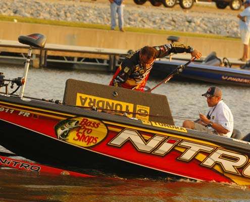 <p>
	 </p>
<p>
	Kevin VanDam pulls his rods from his rod box while his boat is being launched Sunday morning.</p>
