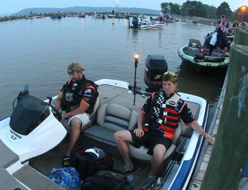 <p>
	Trevor Parks and Chase Edmiston wait as the first boat to leave the dock on Day One.</p>
