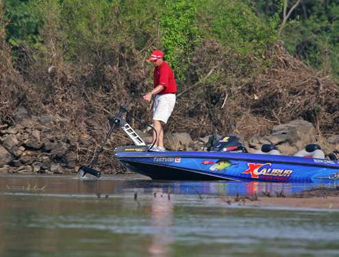 <p>
	Jones pulls up his trolling motor as he scouts the Arkansas River on Monday.</p>
