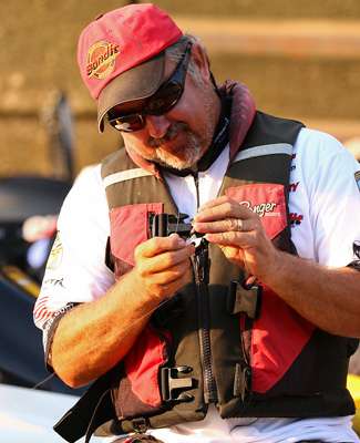 <p>
	Pete Pond retied several baits while waiting in the lock.</p>

