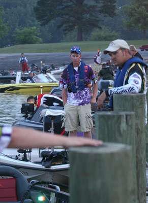 <p>
	Anglers stand along the line-up for boat check early on Thursday.</p>
