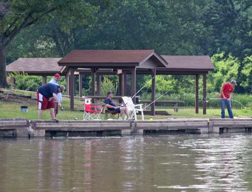 <p> 	A group of local anglers fish from the bank on a sunny June day in Little Rock.</p> 