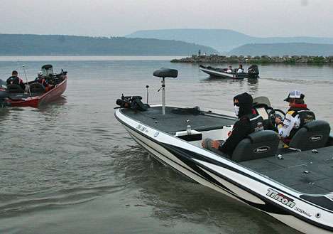 <p>
	The first three boats make their way out onto Lake Dardanelle at 6 a.m. sharp.</p>
