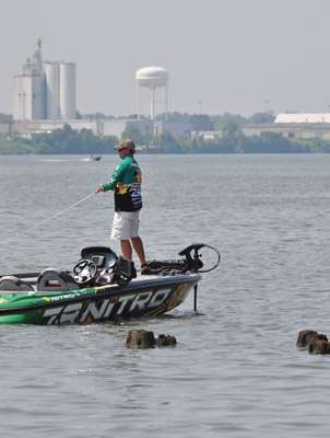 <p>
	Tim Horton fishes with Pine Bluffâs industrial area in the background.</p>
