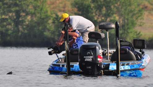 <p>
	Denny Brauer fights a bass to the boat on Sunday.</p>
