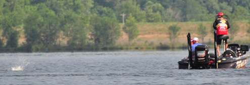 <p>
	A bass jumps at the end of Kevin VanDamâs line on Day Four.</p>
