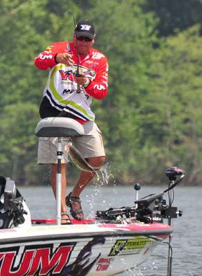 <p>
	Reed swings a sizeable largemouth into the boat on Day Four of the Diamond Drive.</p>
