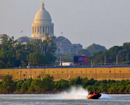 <p>
	Bradley Hallman speeds along the river beneath the shadow of the capital building in downtown Little Rock.</p>
