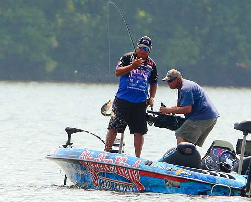 <p>
	Brauer boats his first keeper fish of the day. </p>
