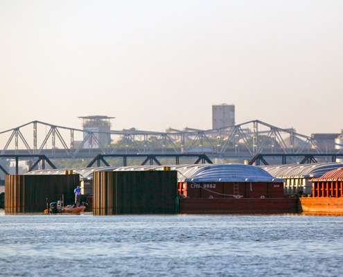 <p>
	James Niggemeyer fishes near several barges tied off within sight of downtown Decatur. </p>
