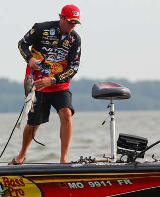 <p>
	 </p>
<p>
	VanDam realizes the strong wind is blowing on top of his waypoint, and moves to the front of the boat to check his GPS. </p>
