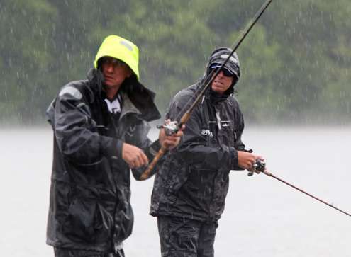 <p>
	Kevin Wirth and Russ Lane watch Horton fishing on the other side of the bridge.</p>
