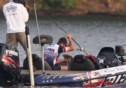 <p>
	David Walker gets a hand on this 3-pounder and lifts it into the boat.</p>
