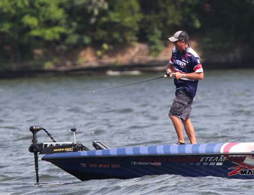 <p>
	Walker sets the hook on a fish on Saturday.</p>
