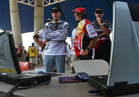 <p>
	 </p>
<p>
	Aaron Martens, Paul Elias and Jared Lintner watch the scoreboard on the B.A.S.S. computers.</p>
