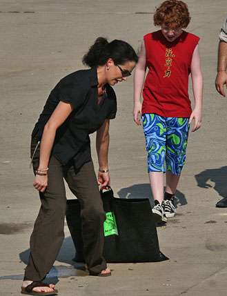 <p>
	 </p>
<p>
	Amy Reinhold, wife of actor Judge Reinhold, shows Grayson Russell how he should go about dragging the bag for a scene for a movie.</p>
