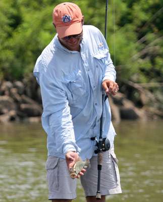 <p>
	Kennedy gently tosses this bass back into the Arkansas River.</p>
