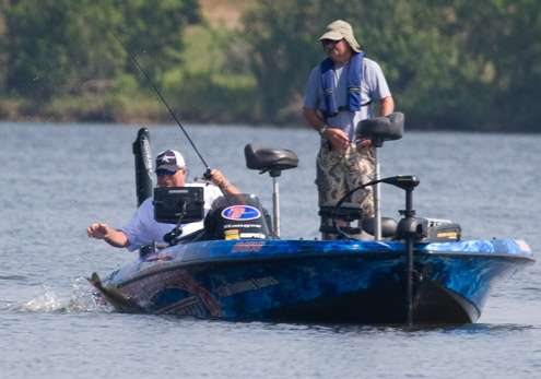 <p>
	Denny Brauer waits as the bass makes yet another jump and would eventually get this fish in the boat.</p>

