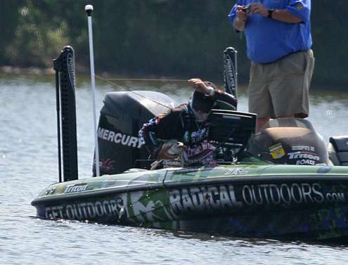 <p>
	VanDam bellies the big fish into the boat on Day Two.</p>

