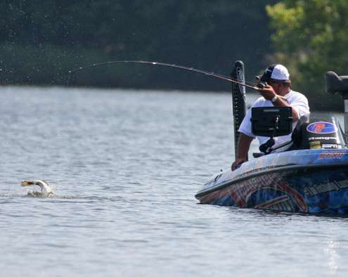 <p>
	The bass splashes water everywhere as Brauer sits down to land it.</p>

