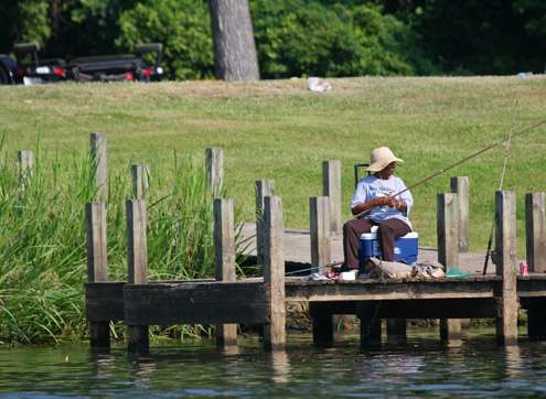 <p>
	A shore angler enjoys the day as the water in the Pine Bluff Harbor was higher than on Day Two.</p>
