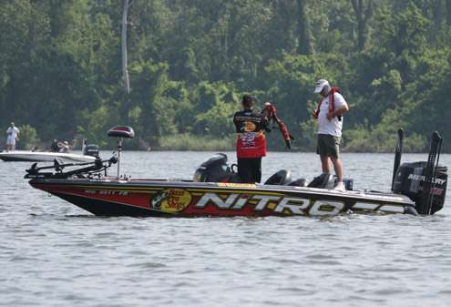 <p>
	Kevin VanDam and his cameraman put on their PFDs to move to another area.</p>
