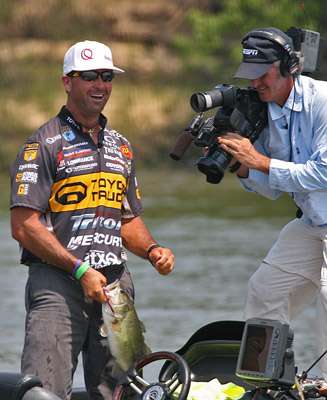 <p>
	Gerald Swindle smiles for the crowd after catching this nice Arkansas River largemouth.</p>

