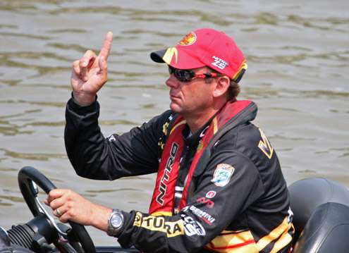 <p>
	VanDam signals to the person driving his truck to pull up a little more as he prepares to load his boat.</p>
