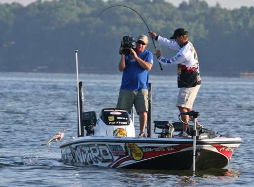 <p>
	The bass shakes its head, but Evers gets enough momentum to get the fish over the side.</p>
