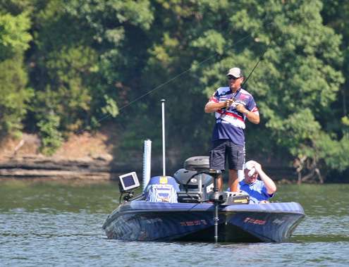 <p>
	David Walker sets the hook on a fish midway through the first day of competition.</p>

